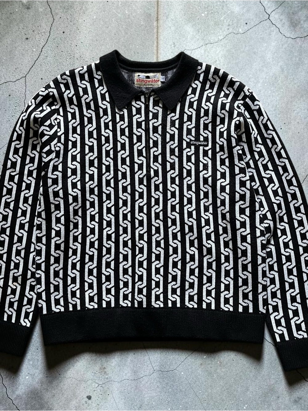 stingwater chain polo sweater